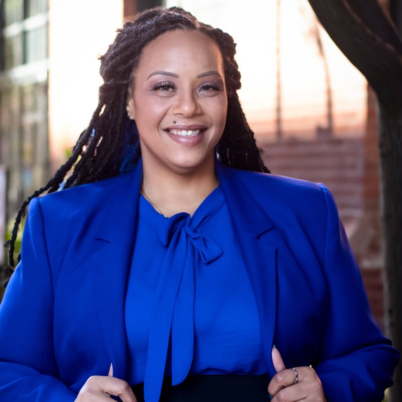 woman smiling with blue suit on 